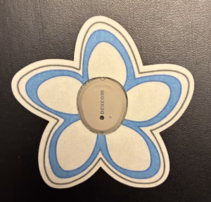 Plumeria Designed precut adhesive patch to secure all diabetic devices